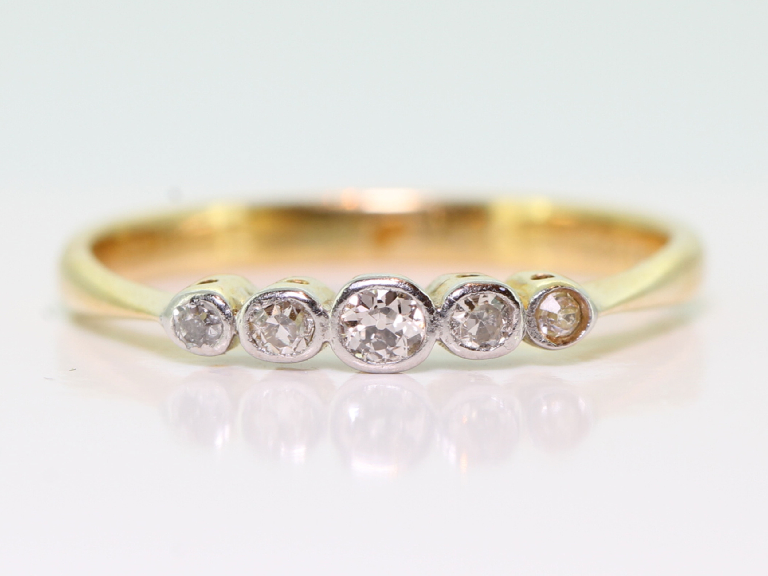 Pretty 18 carat gold and platinum art deco five stone diamond ring