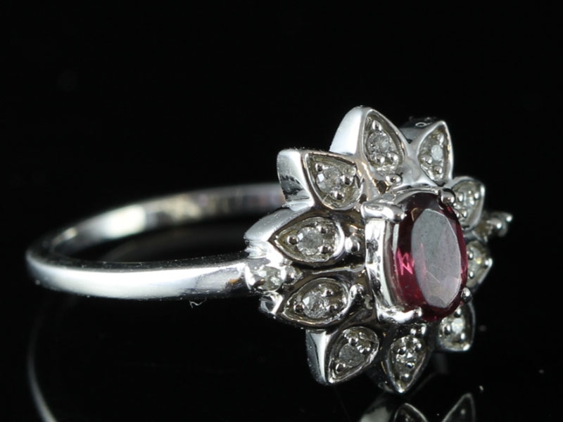 Elegant ruby and diamond cluster 9 carat gold ring 