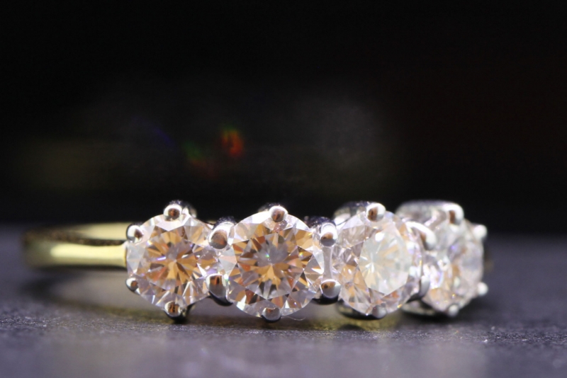 Captivating four stone diamond 18 carat gold ring