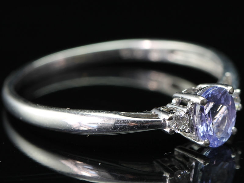Beautiful oval cut tanzanite and diamond 9 carat gold trilogy ring