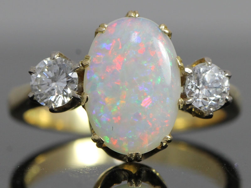 Fabulous opal and diamond trilogy 18 carat gold ring