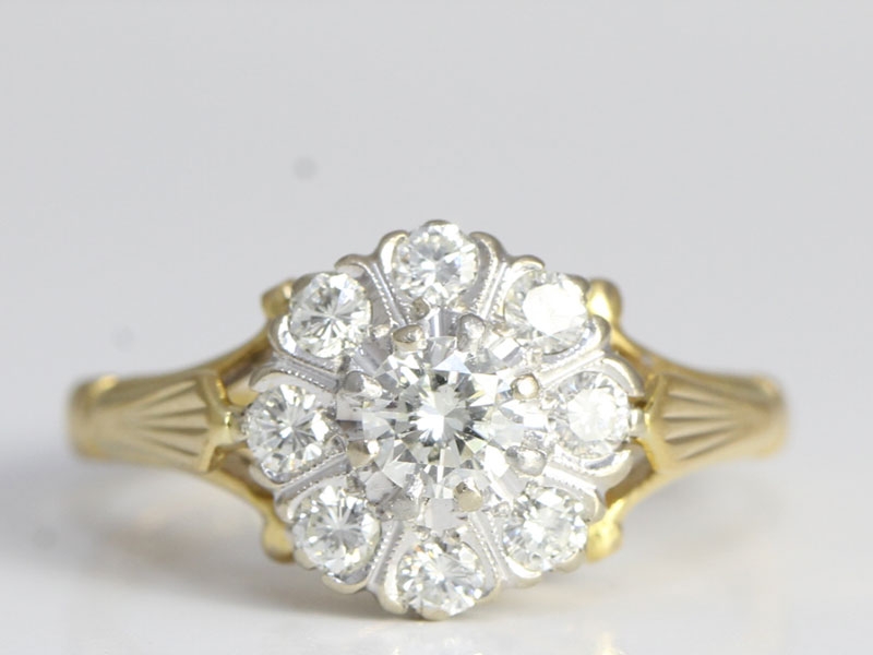 Wonderful diamond daisy 18 carat gold and platinum ring