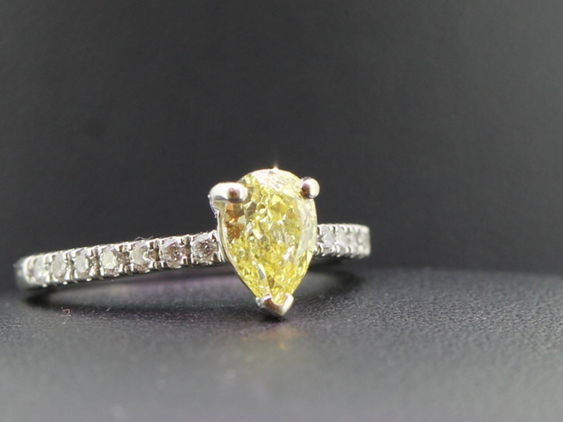 Spectacular yellow pear shaped diamond and white diamond 18 carat gold ring
