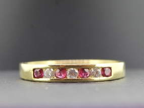 LOVELY RUBY AND DIAMOND HALF ETERNITY 18 CARAT GOLD RING