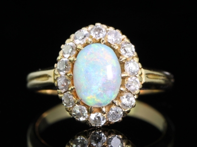 Beautiful Opal and Diamond 18 carat Gold Cluster Ring