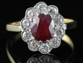 SENSATIONAL RUBY AND DIAMOND CLUSTER 18 CARAT GOLD RING